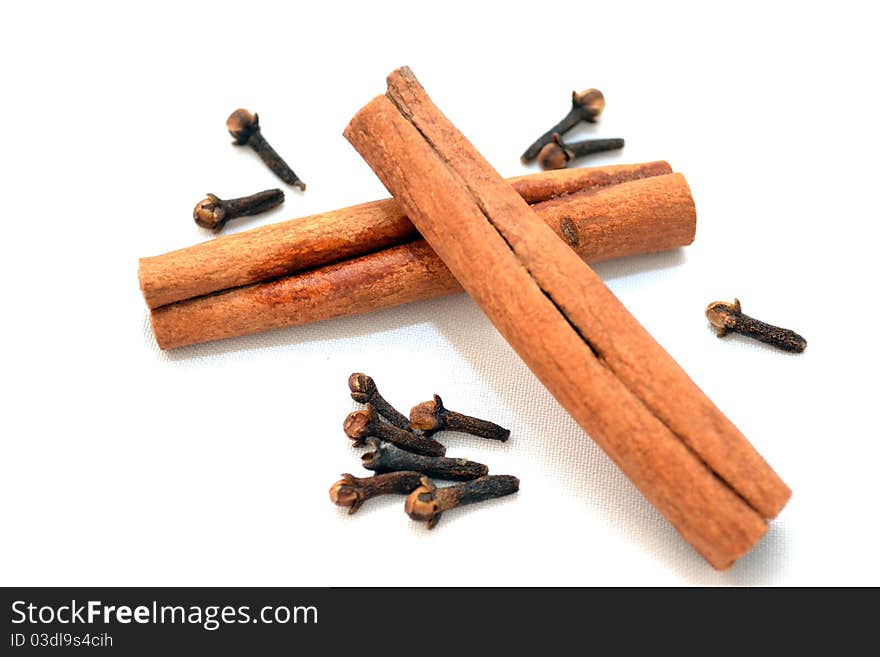 Photo of cinnamon and carnation on a white background