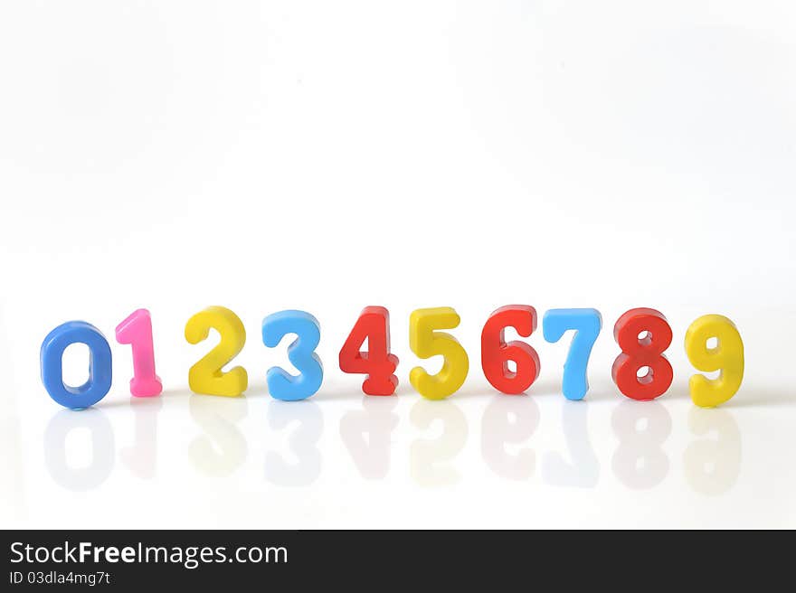 Plastic toy numbers isolated on white