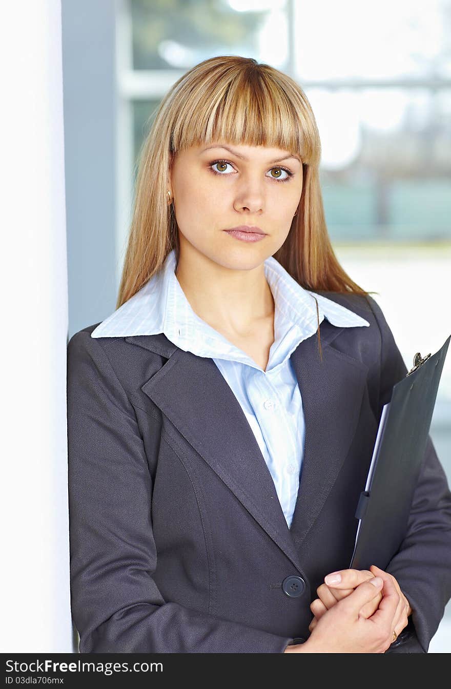 Young business woman with papers