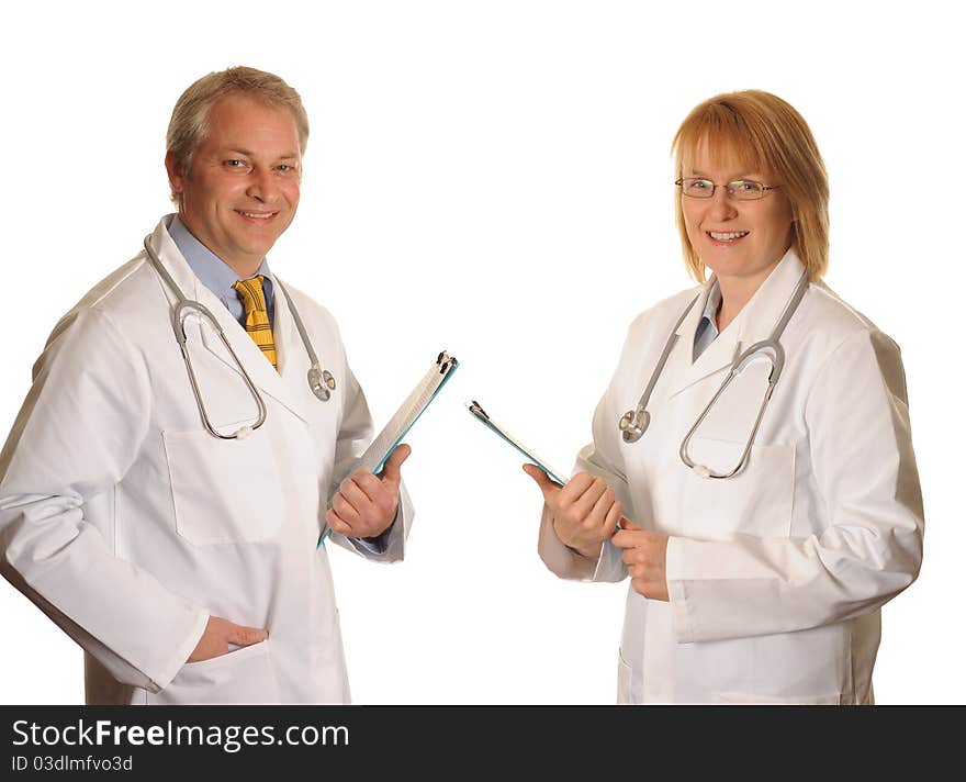 A couple of Doctors with clipboards. A couple of Doctors with clipboards