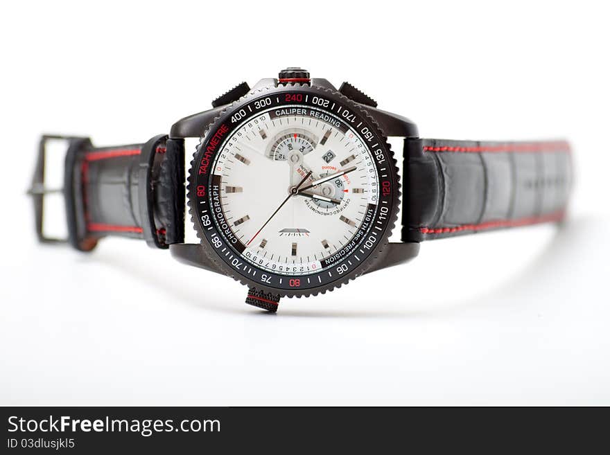 Men's black wristwatch on the white