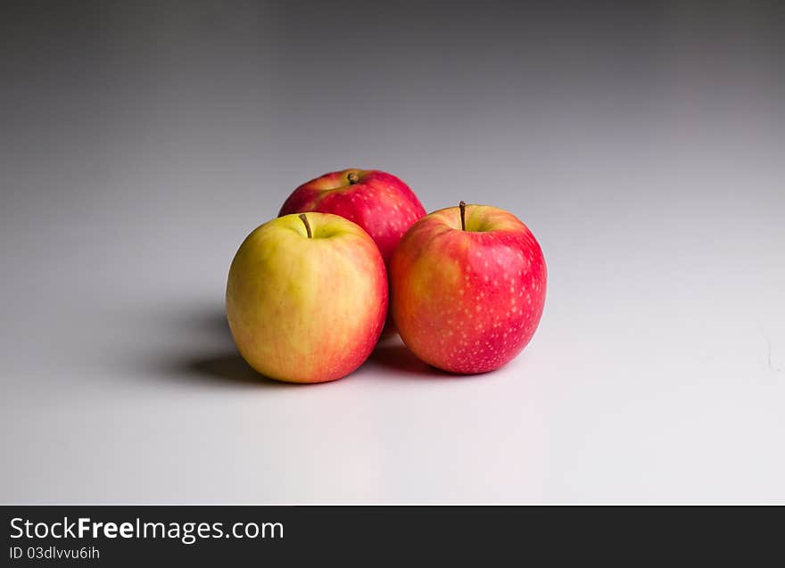 Three Apples on a gradient grey background