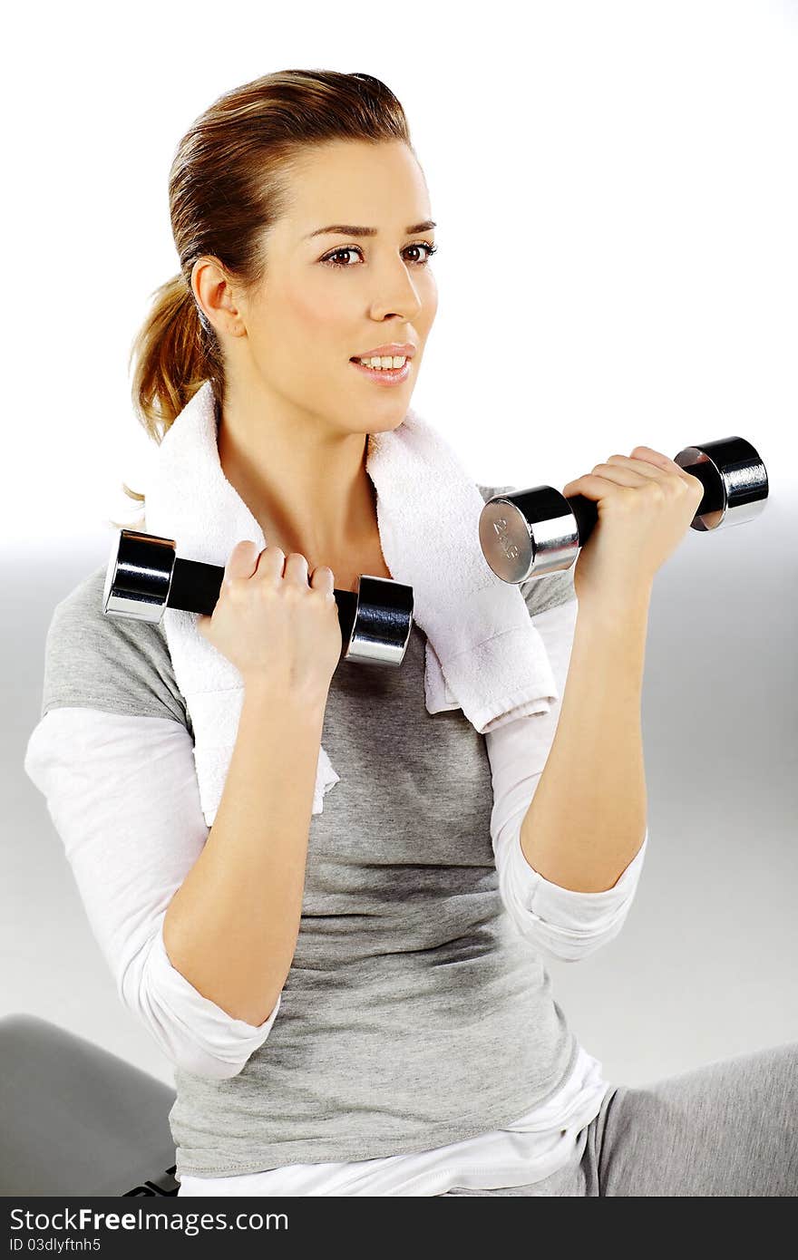 Girl exercising with weights, closeup 3