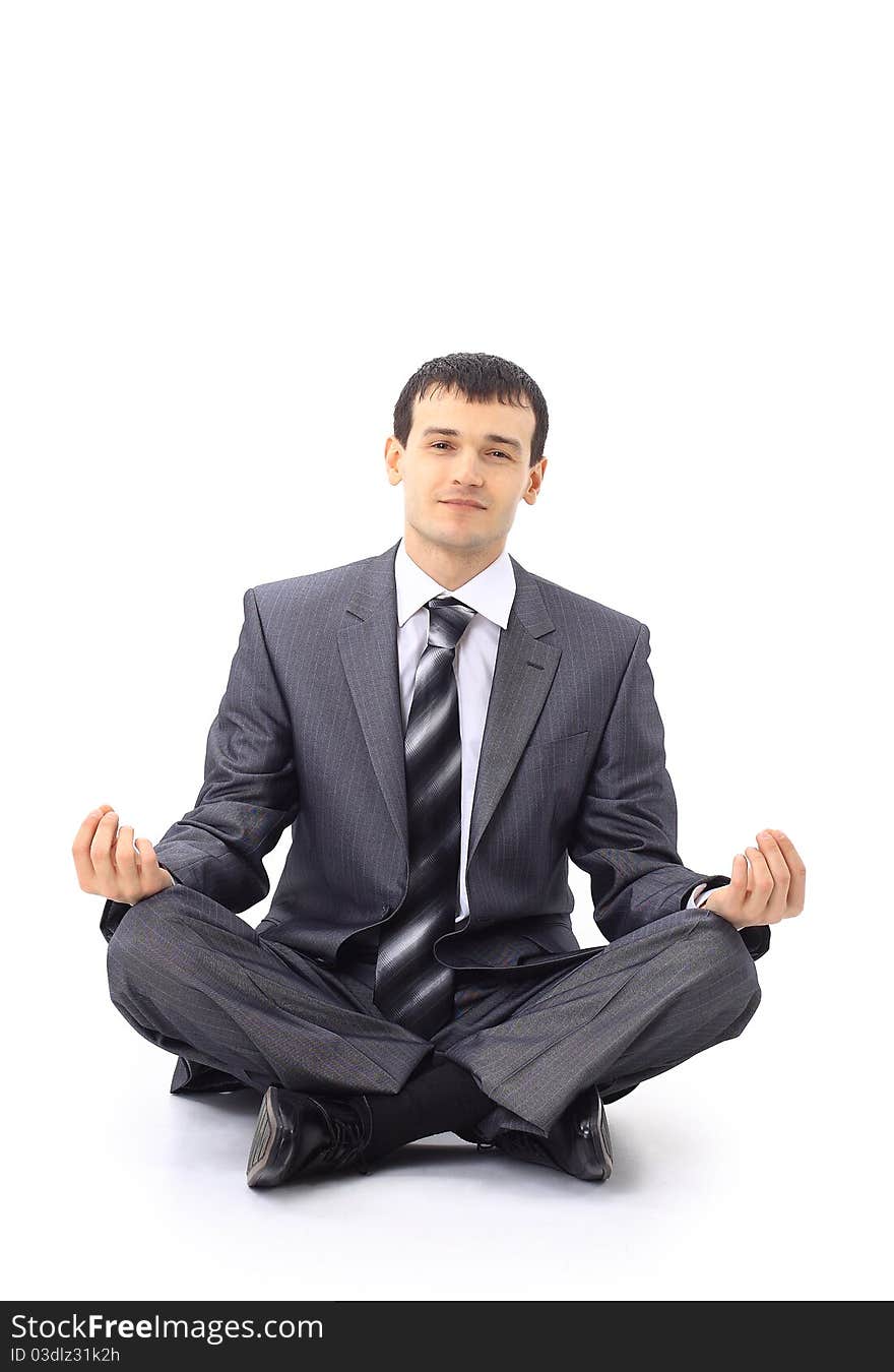 Photo of relaxed businessman meditating over white background