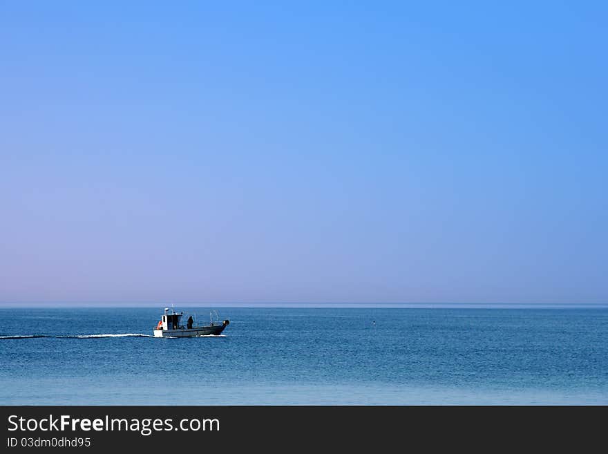 Fishing in the blue sea in summer