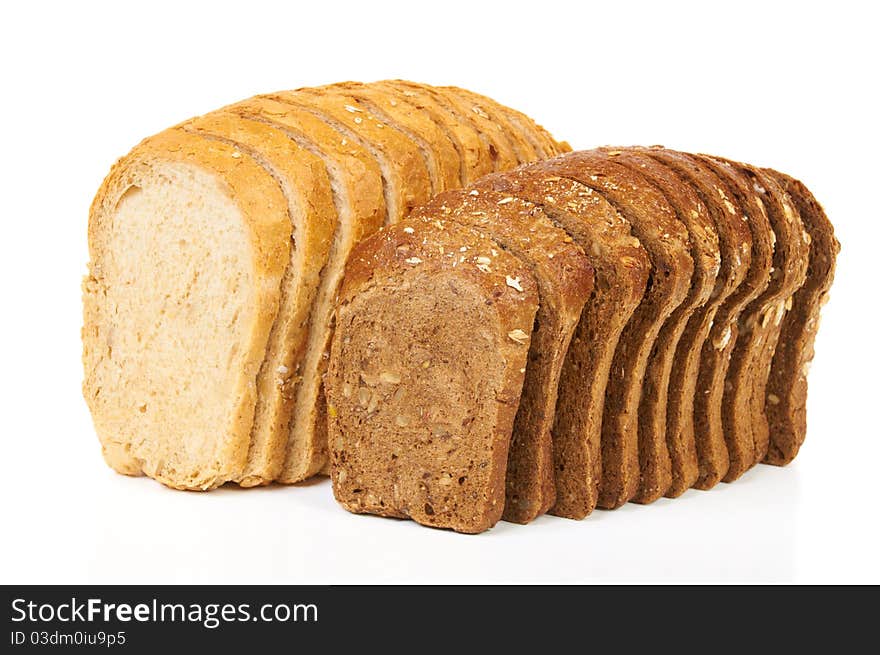 Two loaves of light and dark bread isolated on white. Two loaves of light and dark bread isolated on white