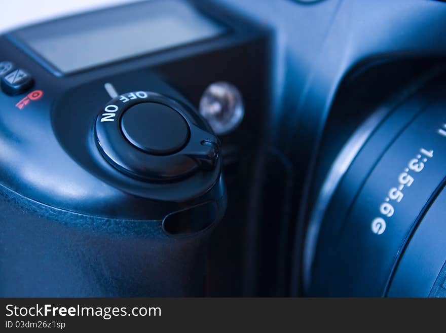 Closeup view of shutter button of analog single-lens reflex full frame camera