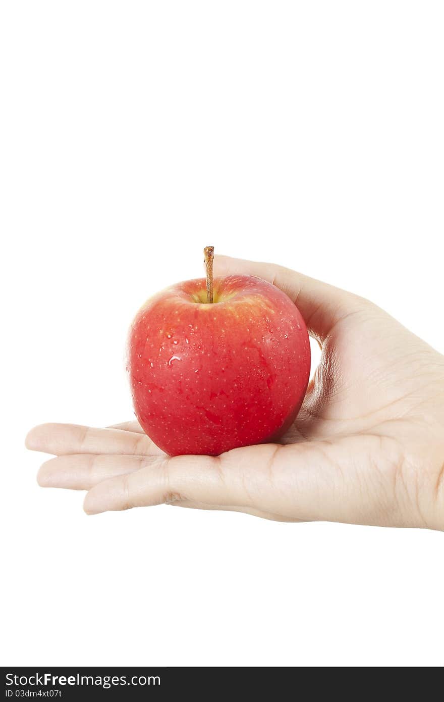 Apple on hand, A hand holding red apple.