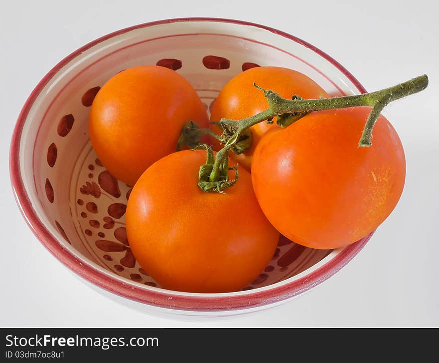 Four red tomatoes