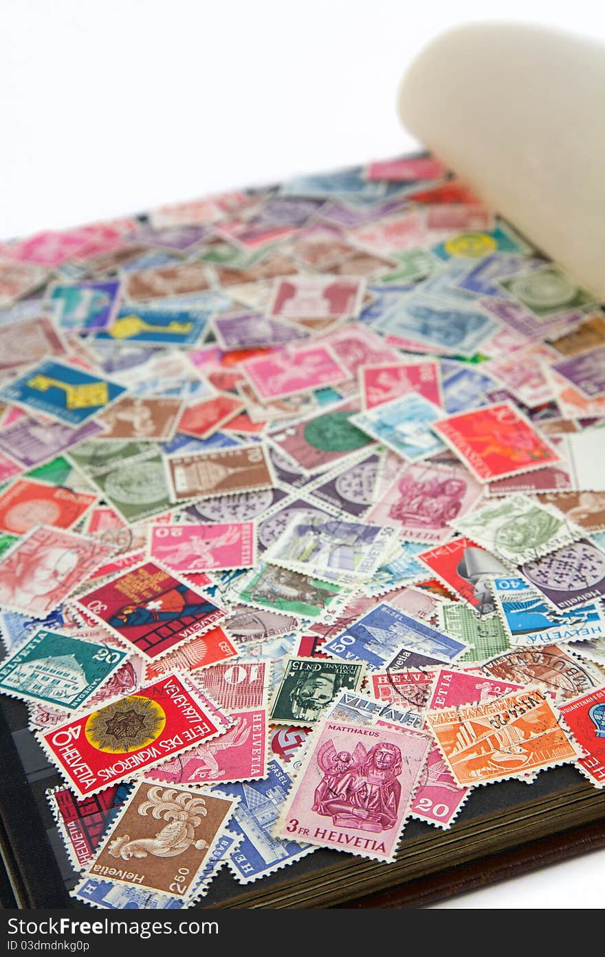 Page of an album covered with Swiss postal stamps. Page of an album covered with Swiss postal stamps