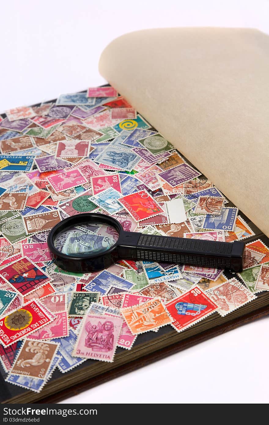 Stamp album with magnifying lens. Stamp album with magnifying lens