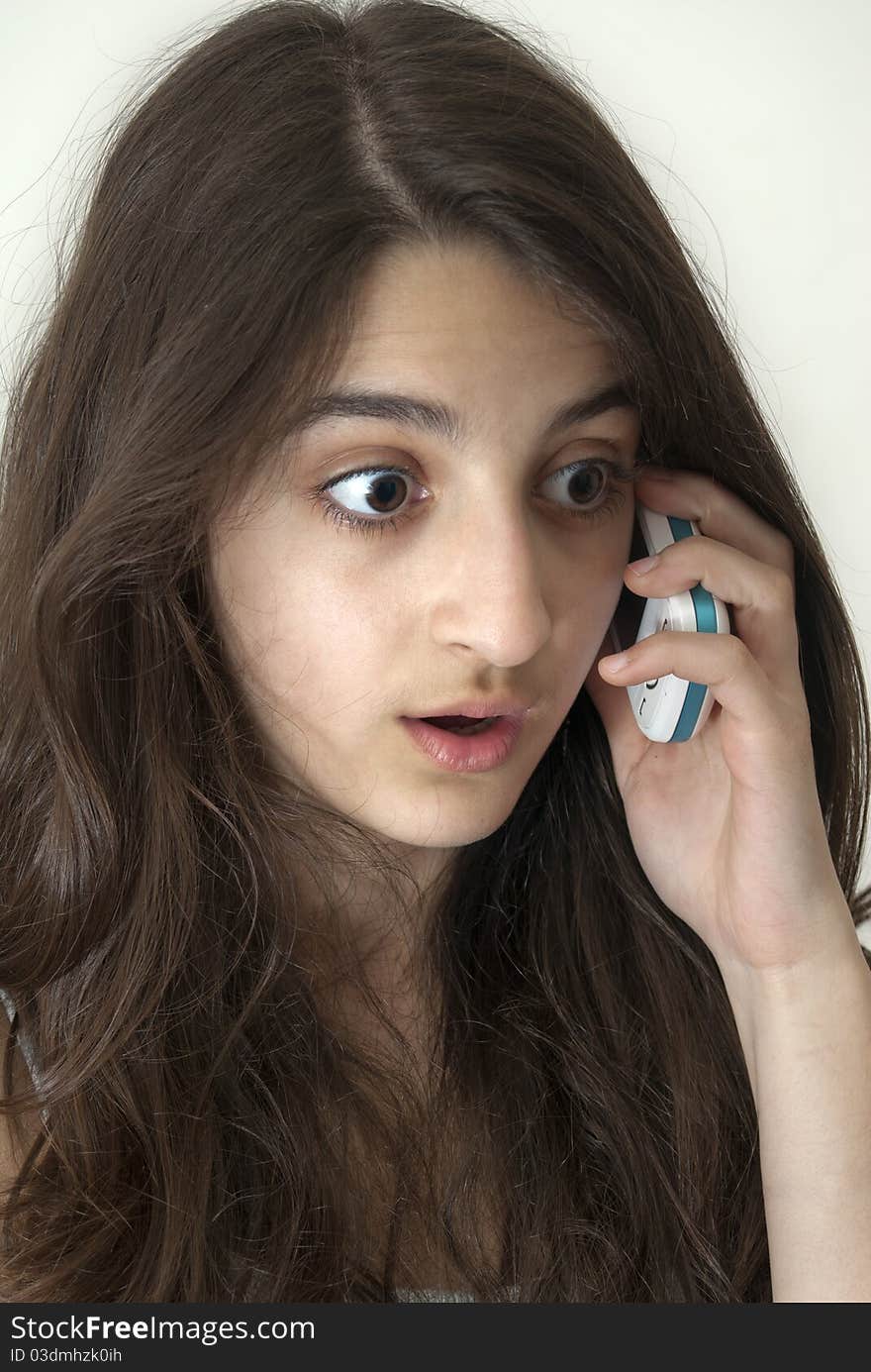 Surprised girl on the phone