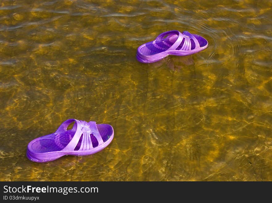 Sneaker floating on the water. Sneaker floating on the water.