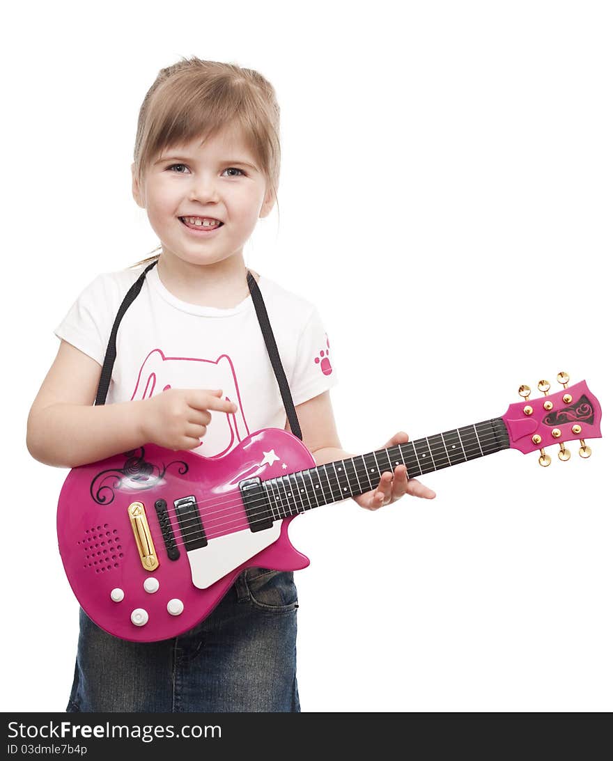 Little girl playing toy pink electric guitar