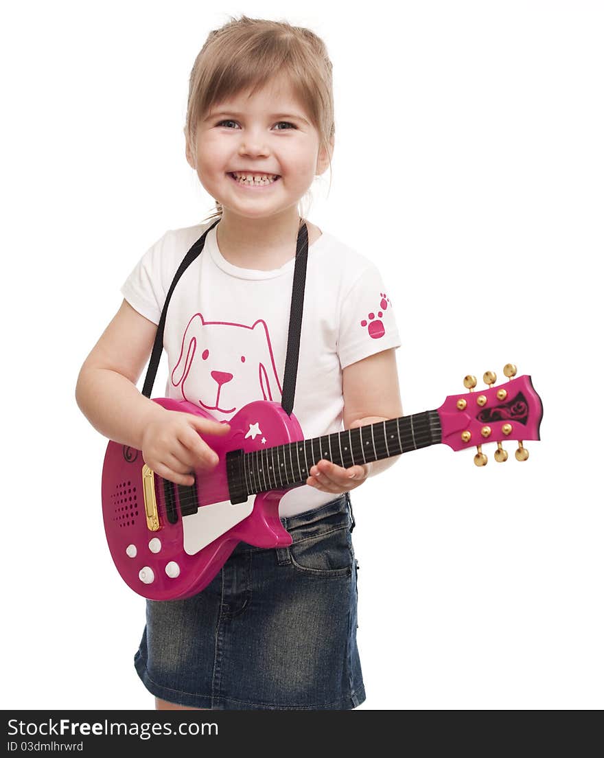 Little girl playing toy pink electric guitar