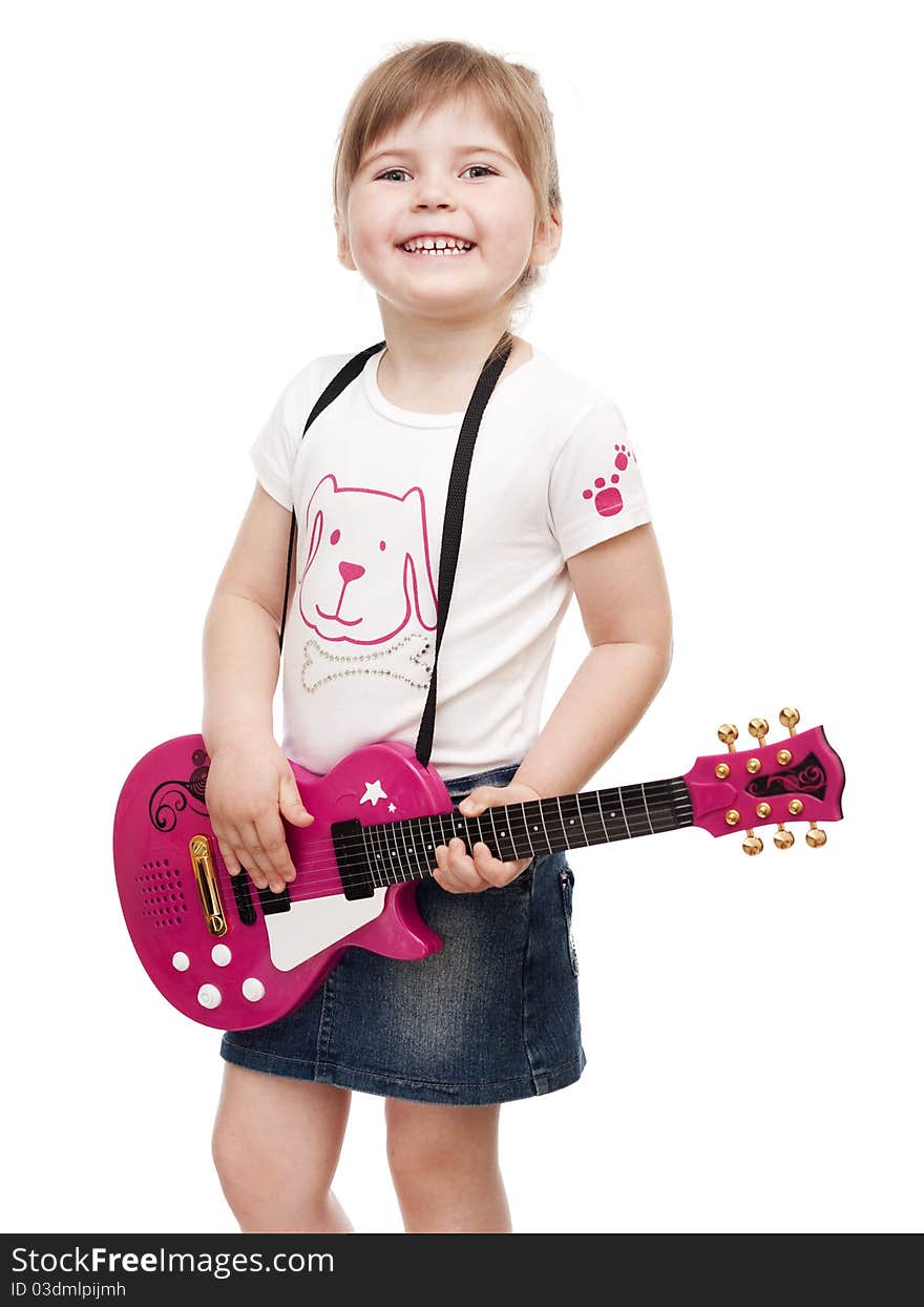 Little girl playing toy pink electric guitar