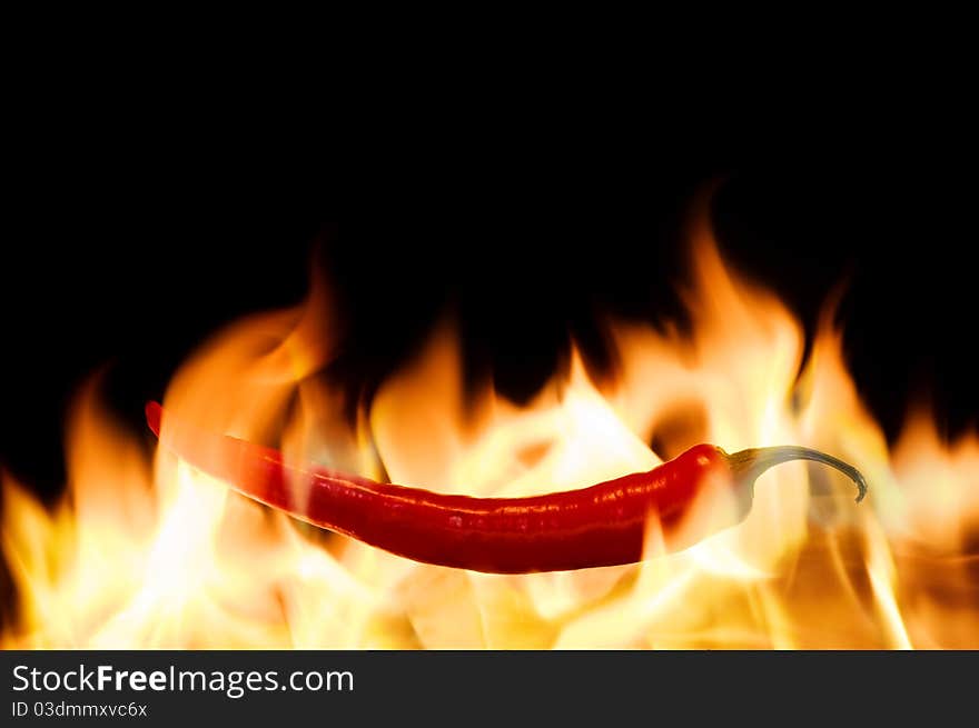 Red pepper in fire flame