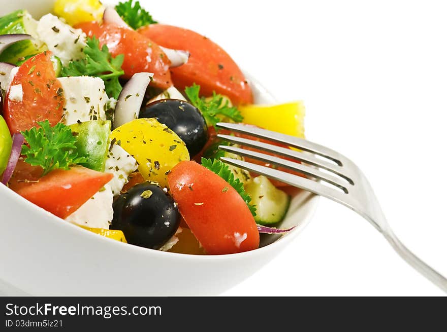 Salad in bowl isolated on white