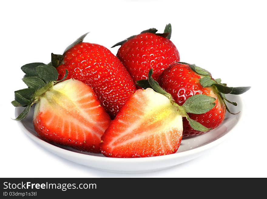 Some beautiful red strawberries on a plate over white background. Some beautiful red strawberries on a plate over white background