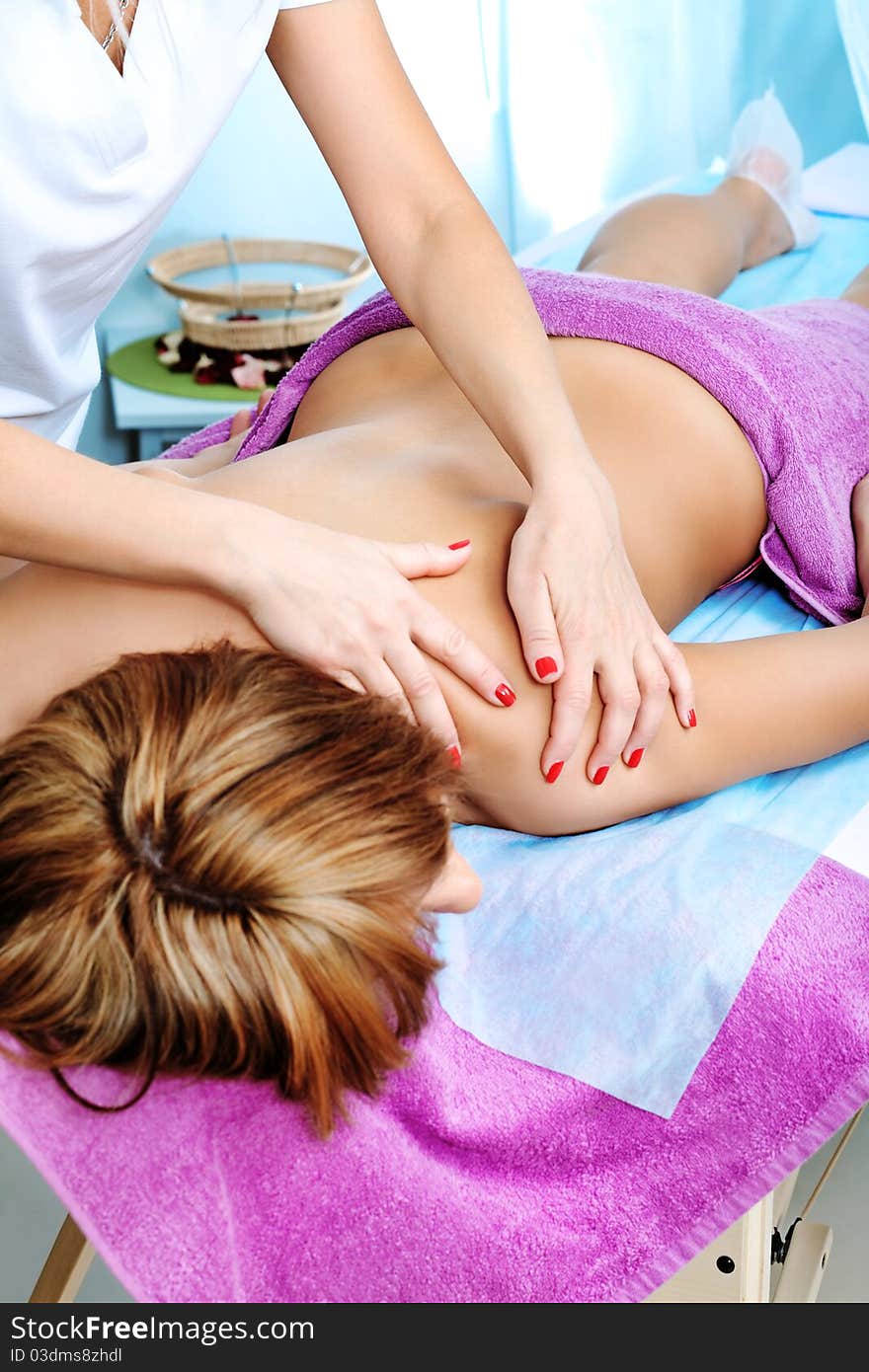 Beautiful young woman on a massage at a salon. Beauty, healthcare. Beautiful young woman on a massage at a salon. Beauty, healthcare.