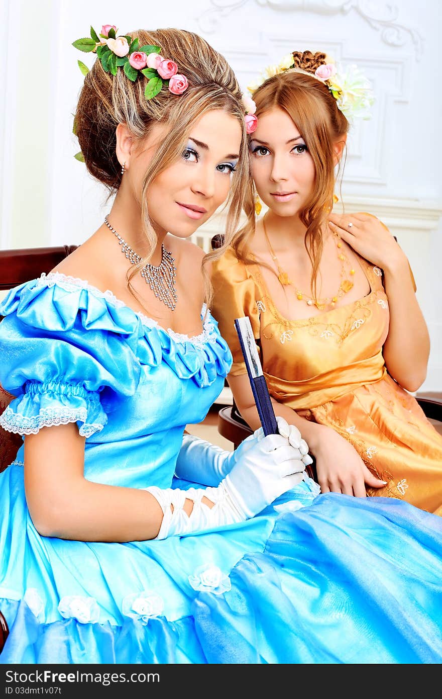 Two beautiful women in medieval era dresses. Two beautiful women in medieval era dresses.