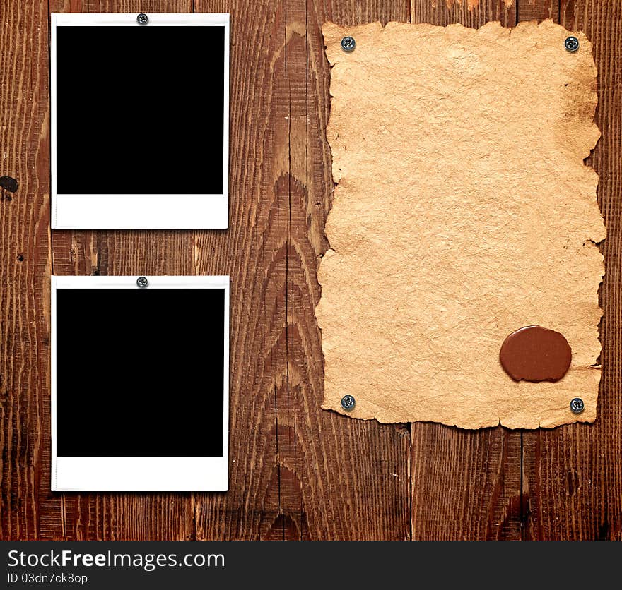 Old paper and photo frames on the wooden wall