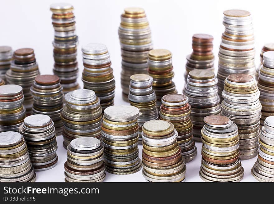 Stacks of various world coins. Stacks of various world coins