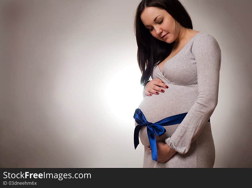 Portrait of joyful beautiful pregnant woman