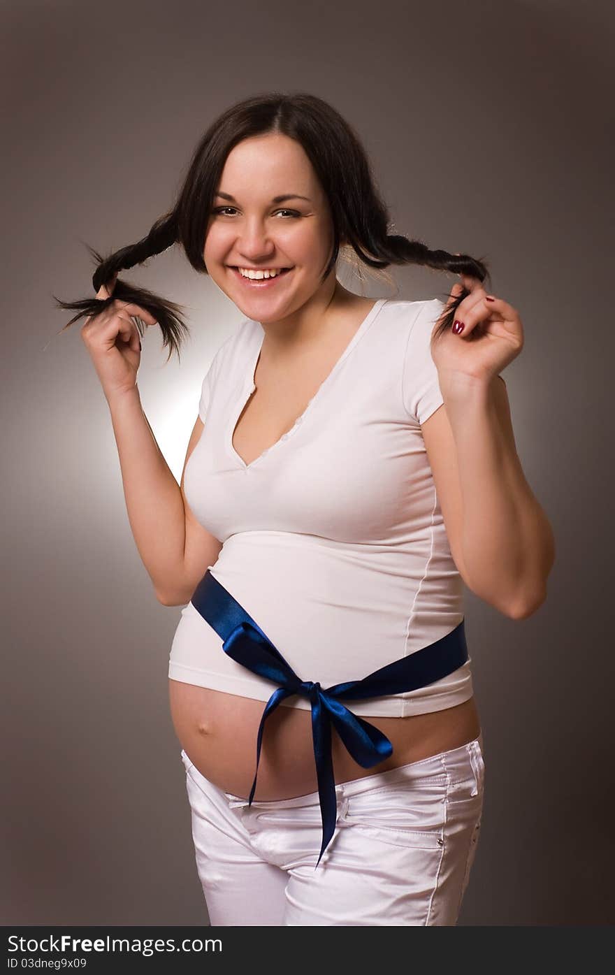 Portrait of joyful beautiful pregnant woman