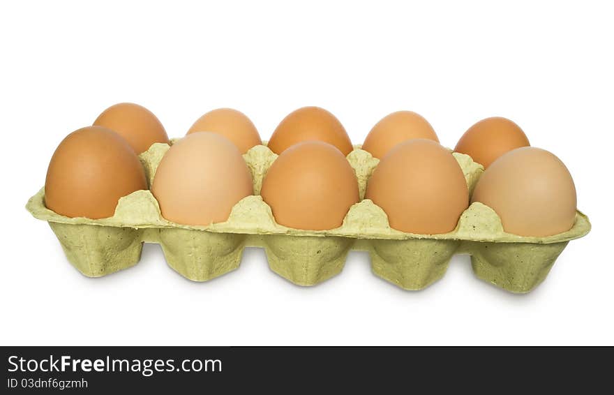 A carton of ten eggs isolated on white background. Clipping path included. A carton of ten eggs isolated on white background. Clipping path included.