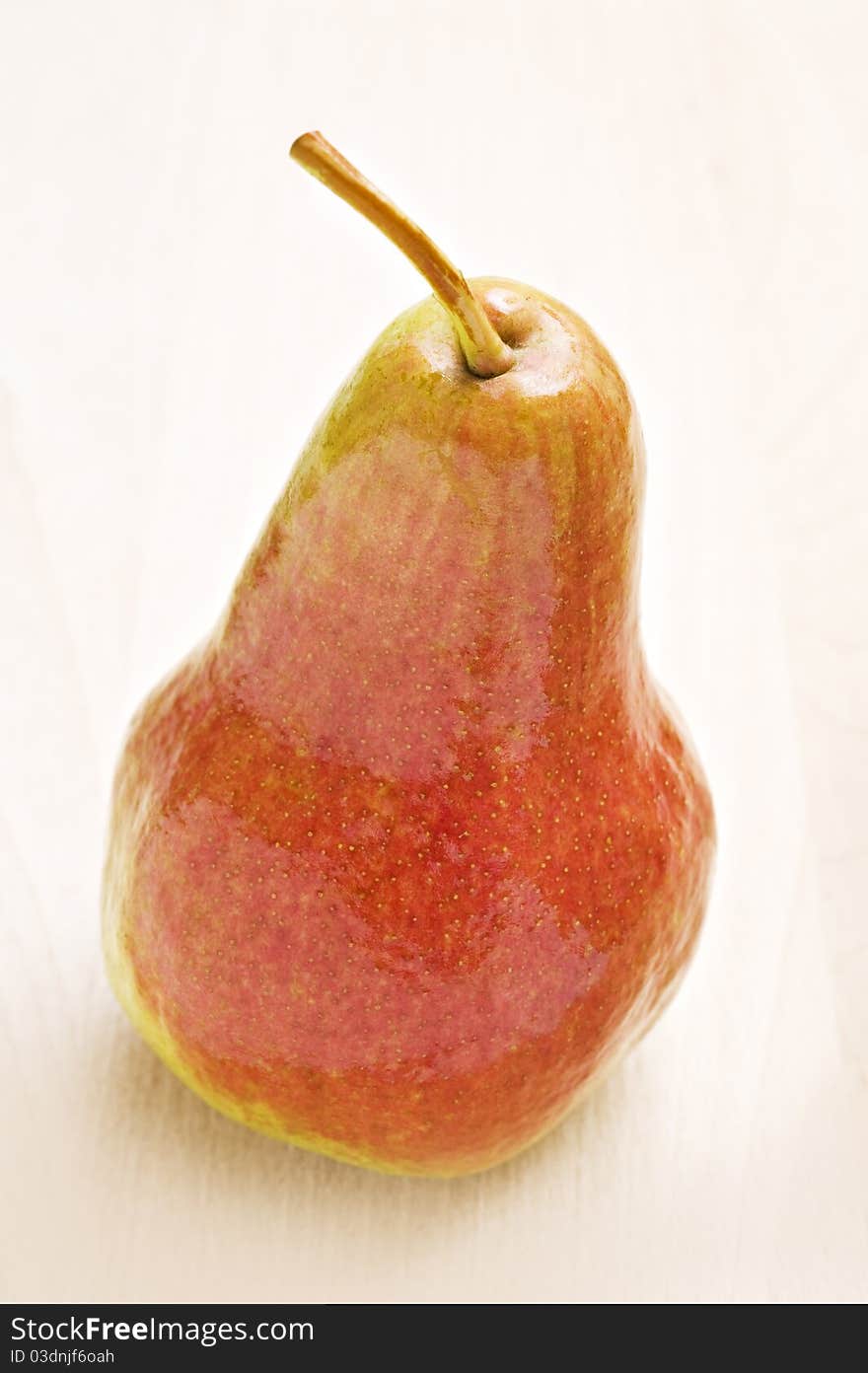 Ripe pear in autumn colors - close up