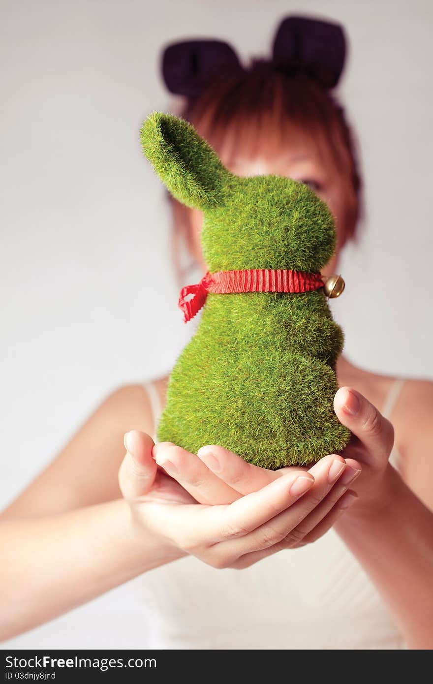 Celebrate Easter, a girl holding a toy rabbit. Celebrate Easter, a girl holding a toy rabbit.