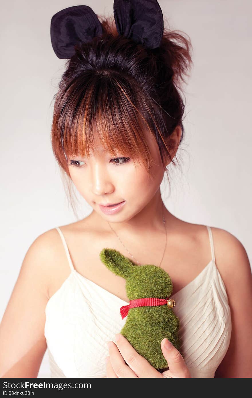 Celebrate Easter, a girl holding a toy rabbit. Celebrate Easter, a girl holding a toy rabbit.