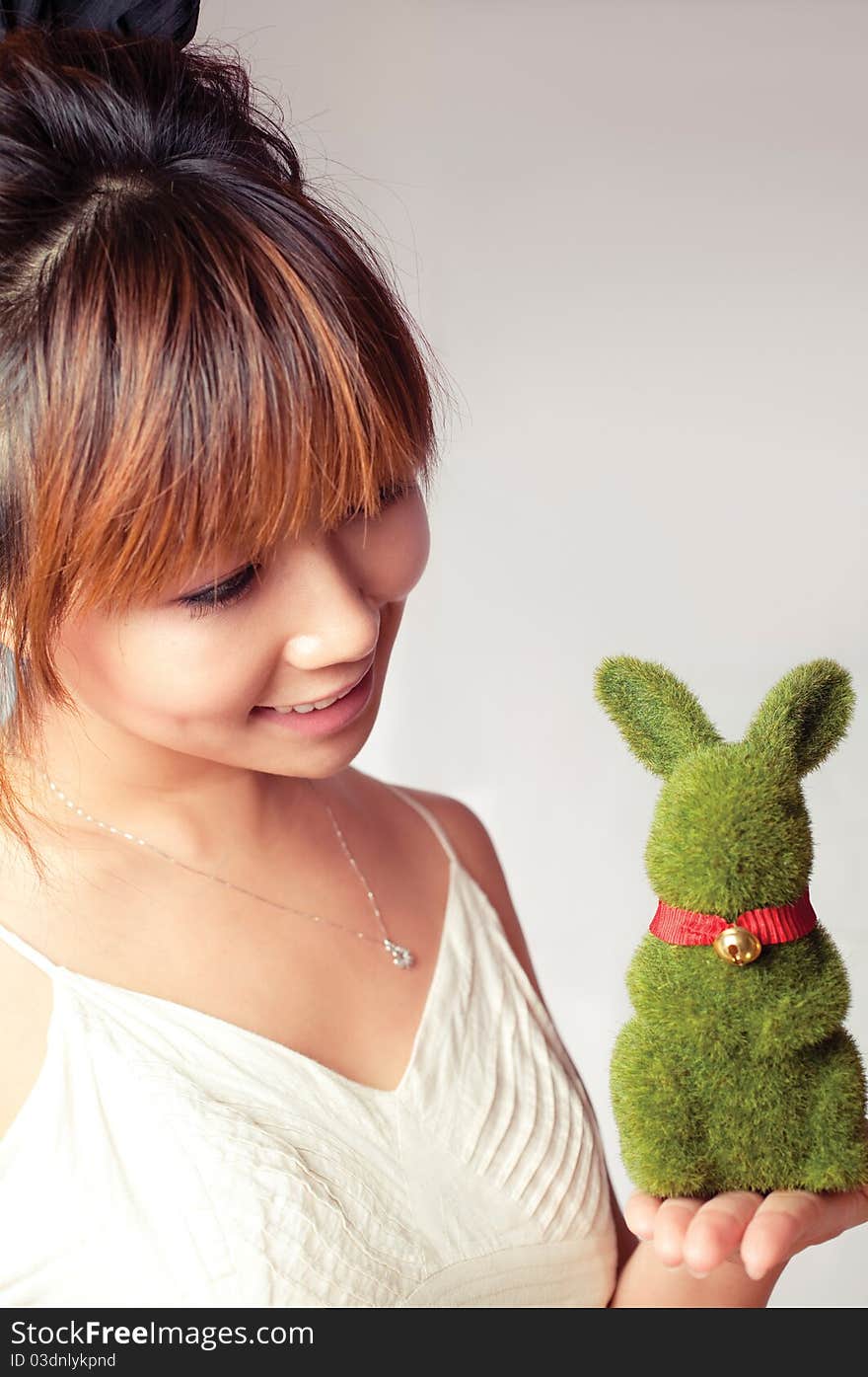 Celebrate Easter, a girl holding a toy rabbit. Celebrate Easter, a girl holding a toy rabbit.