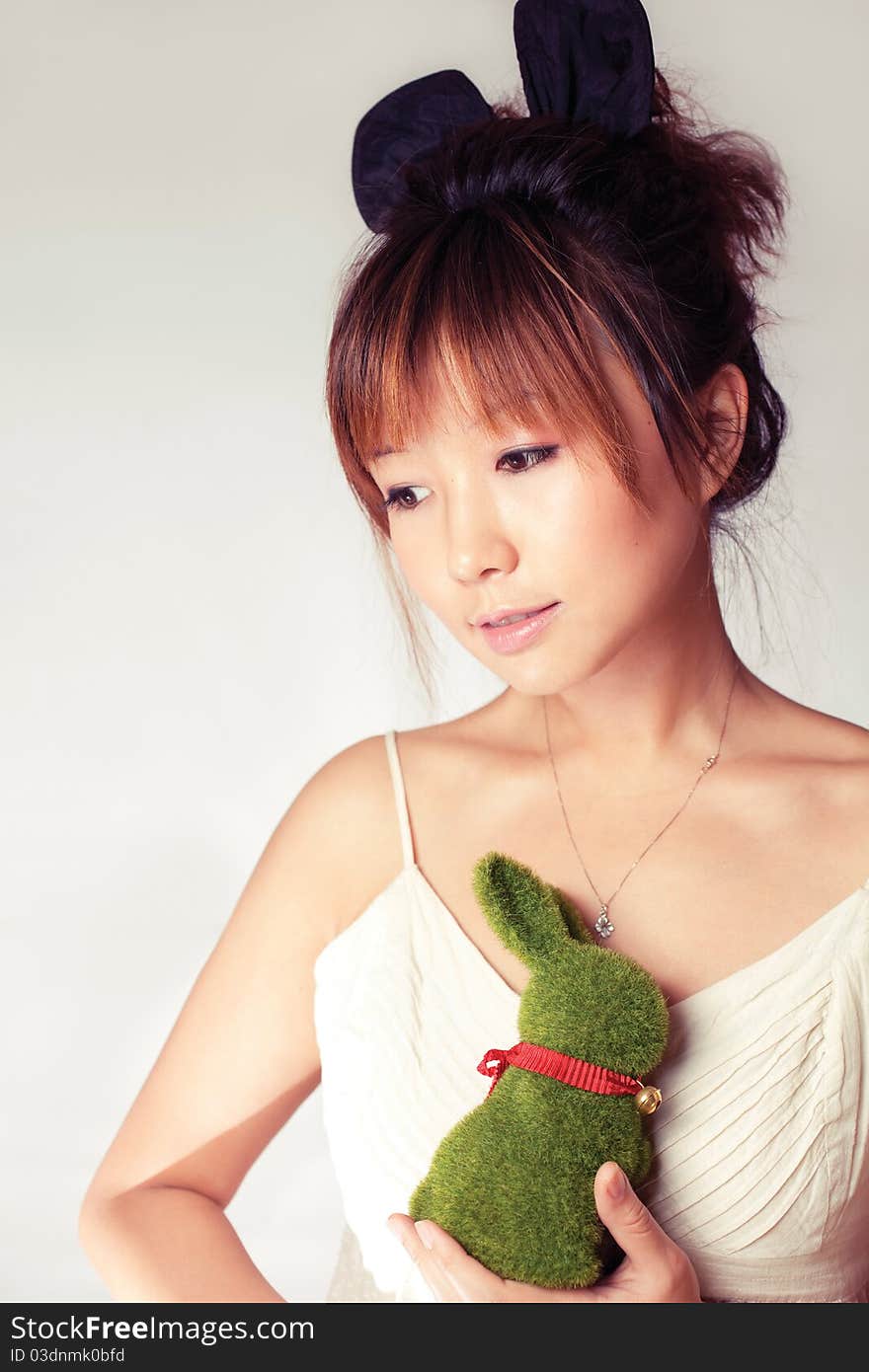 Celebrate Easter, a girl holding a toy rabbit. Celebrate Easter, a girl holding a toy rabbit.