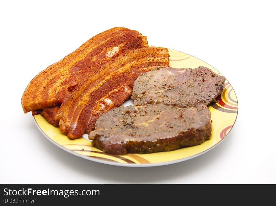 Raw grill meat on ceramics plate