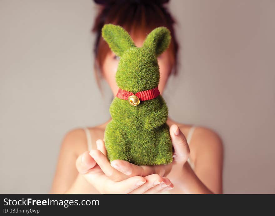 Celebrate Easter, a girl holding a toy rabbit. Celebrate Easter, a girl holding a toy rabbit.