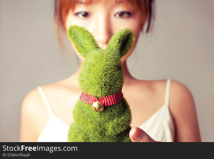 Celebrate Easter, a girl holding a toy rabbit. Celebrate Easter, a girl holding a toy rabbit.