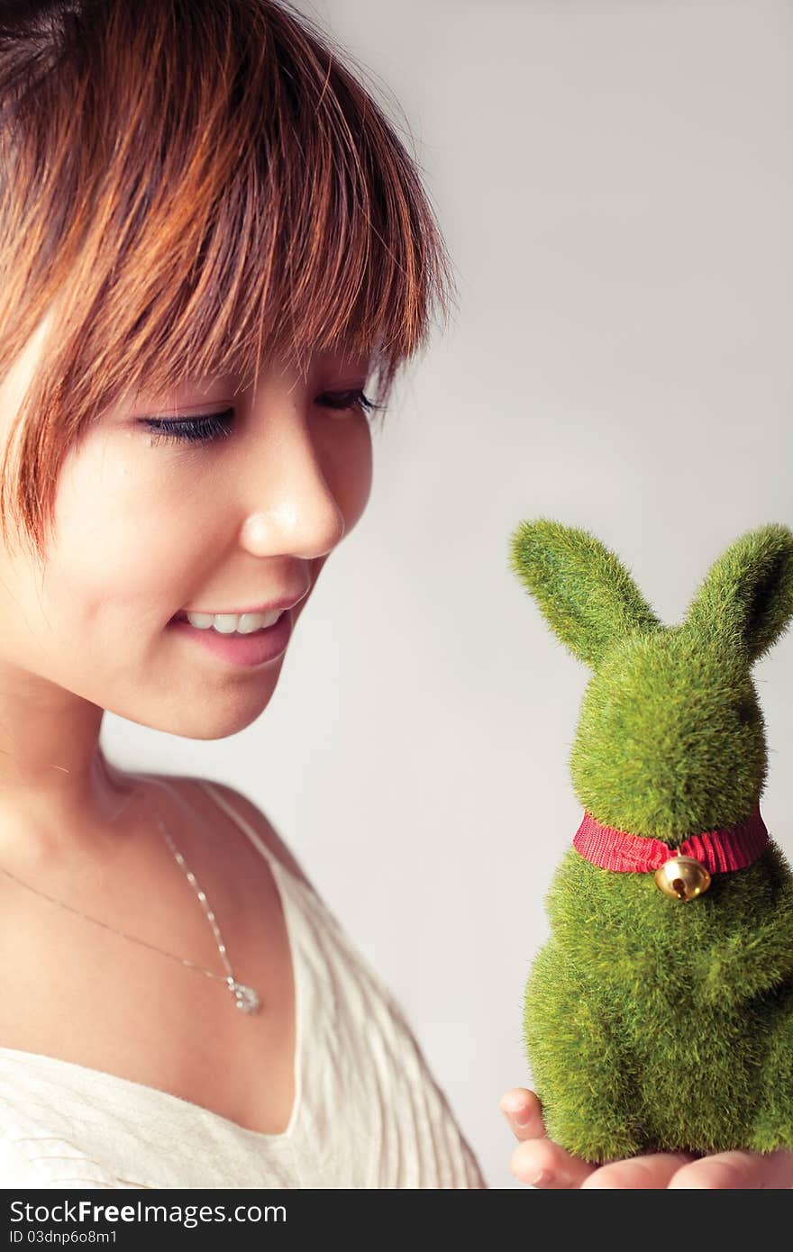 Celebrate Easter, a girl holding a toy rabbit. Celebrate Easter, a girl holding a toy rabbit.