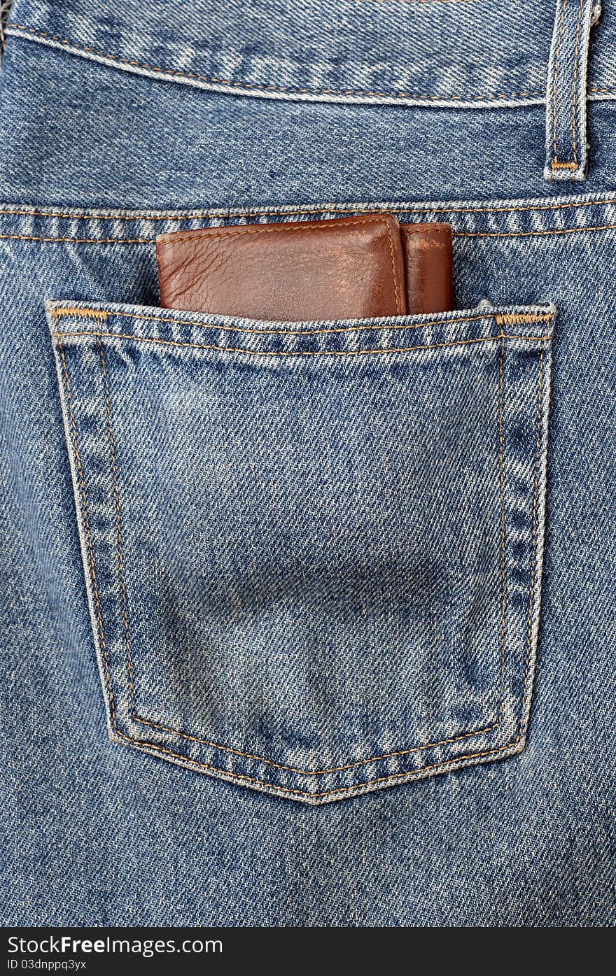 A clean blue jeans with wrench in the back pocket