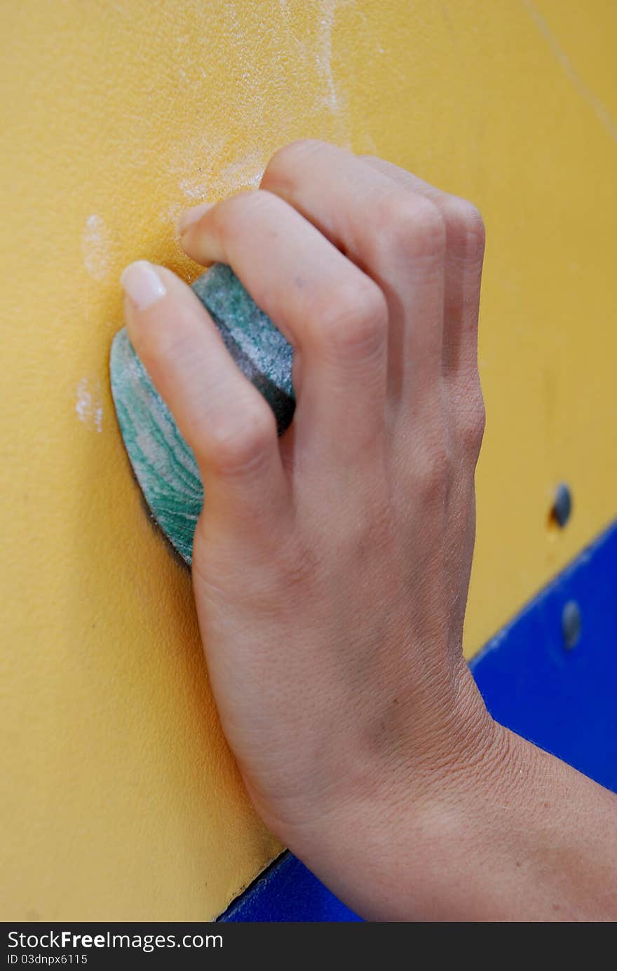 Close up of a left hand of a woman on a socket. Close up of a left hand of a woman on a socket