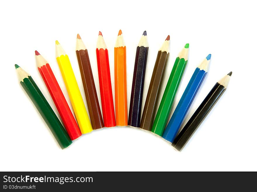 Row of colored pencils on white background. Row of colored pencils on white background