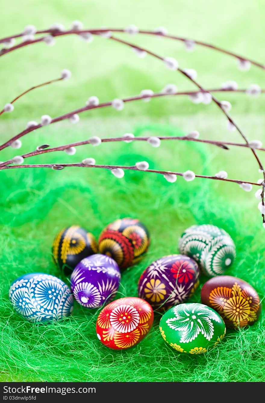 Hand painted easter eggs on green background