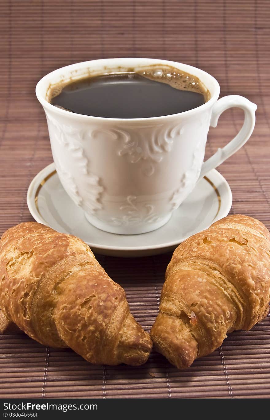 Croissant and coffe in the photo. Croissant and coffe in the photo