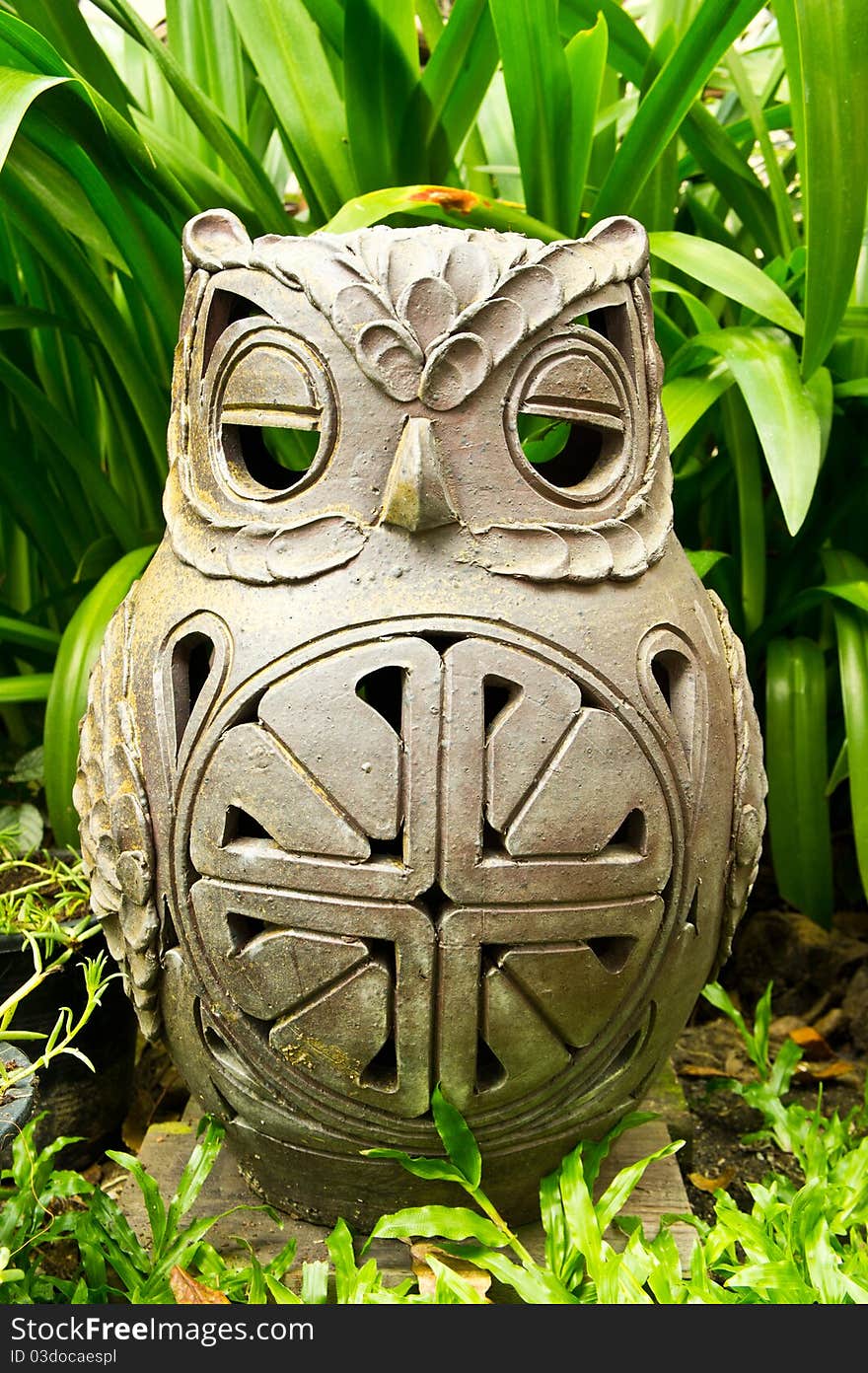 Clay owl in the garden