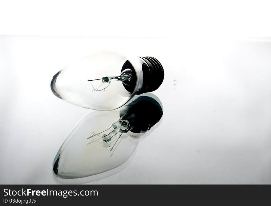 Incandescence bulb on a light white background. Incandescence bulb on a light white background