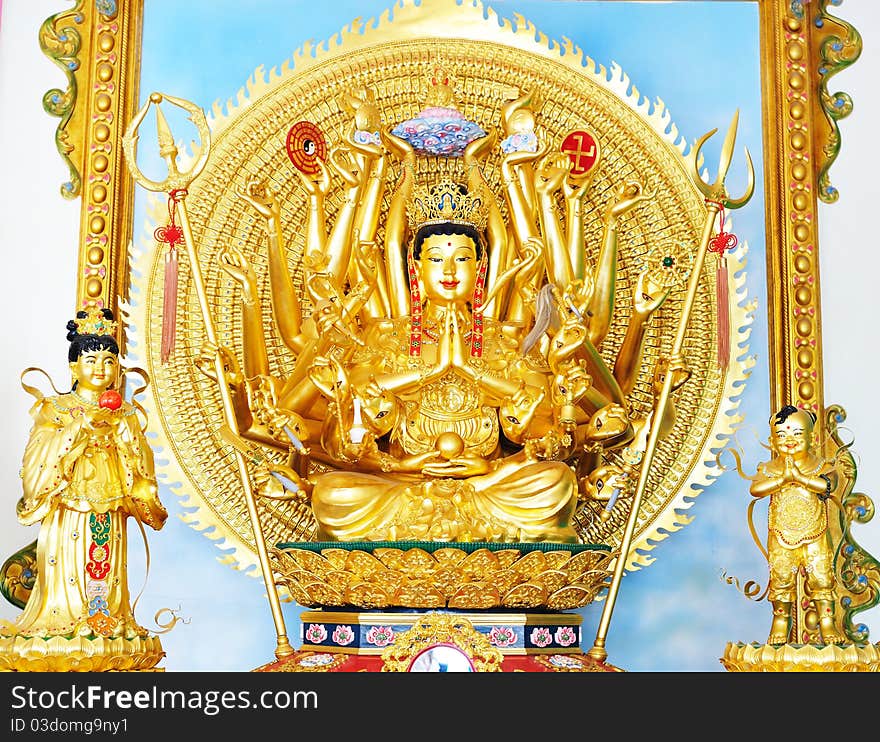 Buddhist Golddess mercy statue isolated on gold. Buddhist Golddess mercy statue isolated on gold