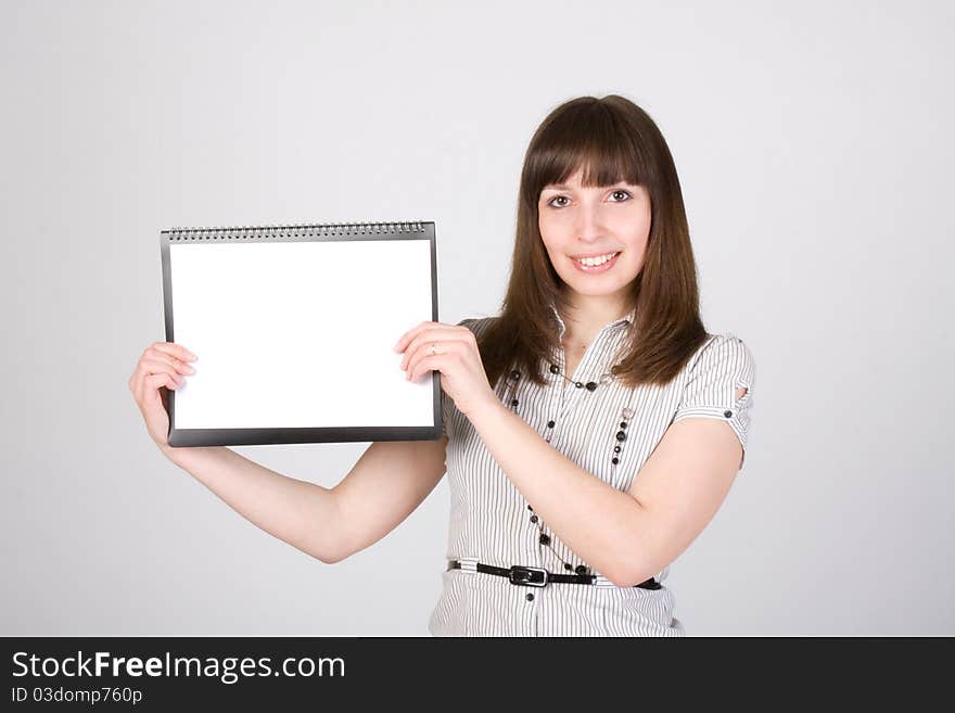 Happy young female holding blank paper. Happy young female holding blank paper