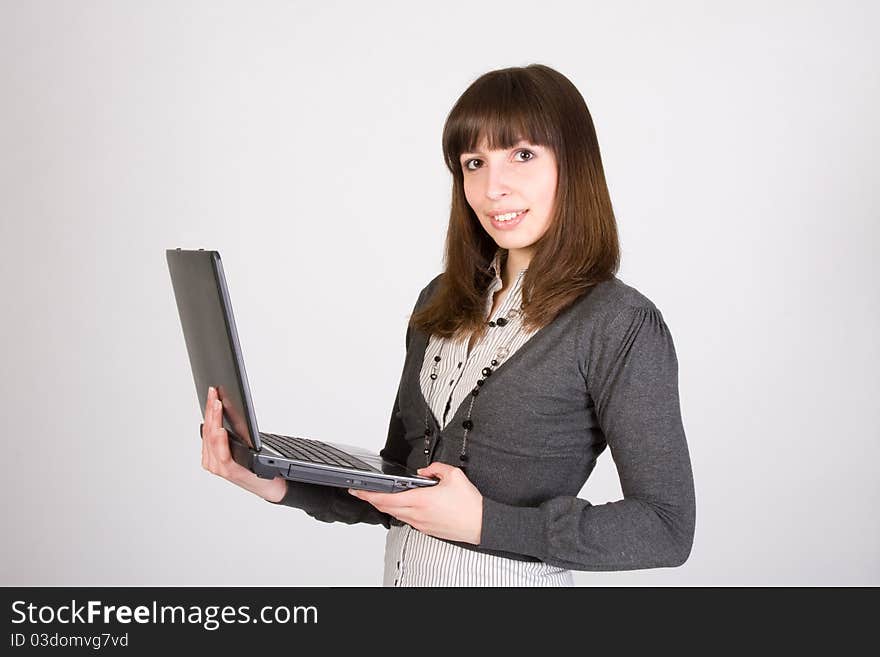 Pretty girl standing with laptop. Pretty girl standing with laptop