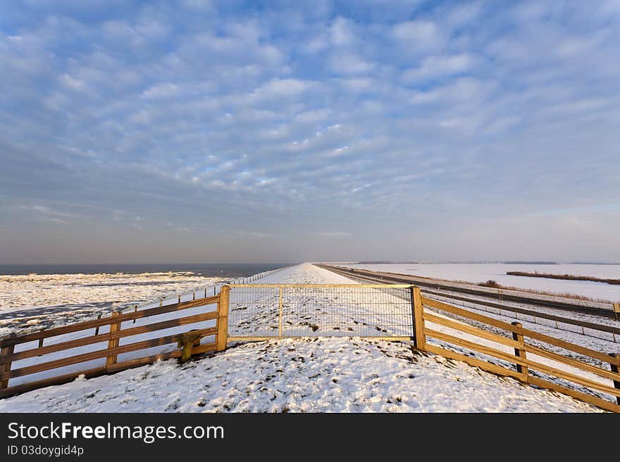 Fence at a winter dike